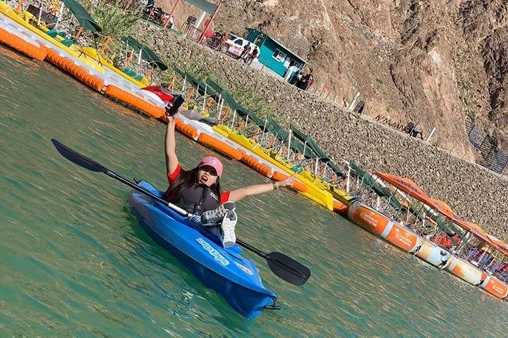 Experience the serene beauty of Hatta Mountain where tranquil waters meet stunning rock formations perfect for kayaking and connecting with nature alongside family and friends.